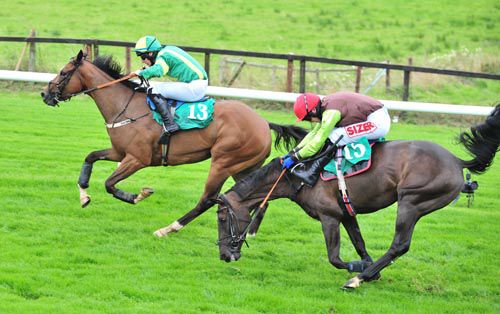 Ciankyle leads after jumping the last from Carlyan who made a bad mistake