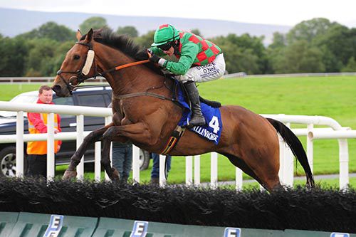 Paul Townend gets another good leap from He Is Top Class