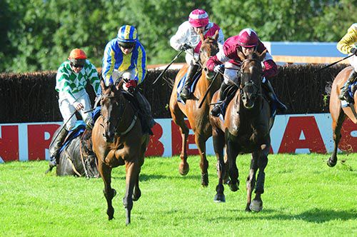 Bryan Cooper (maroon and white) comes through to win on Savello