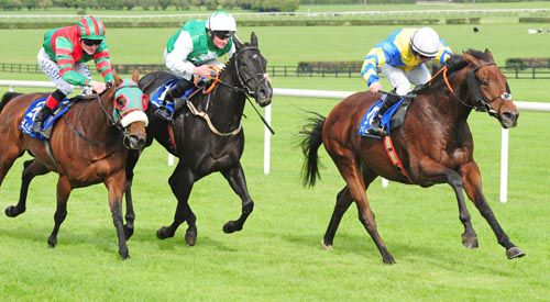 Hatton Cross is driven out by Wayne Lordan to beat Burren View Lady (green & white) and Suburban Sky (blinkers)