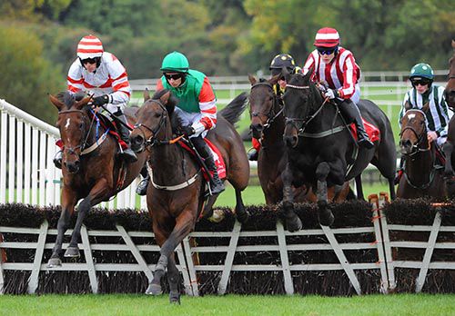 Jarob (second right) jumps a hurdle on his way to victory