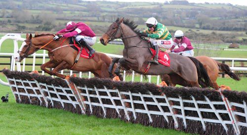 A Great View, near side, comes into contention at the last in Punchestown