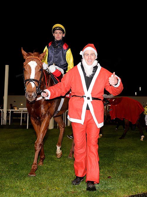 Split The Atom and Donnacha O'Brien are led in by groom 'Santa' Nicky O'Connor after their win 