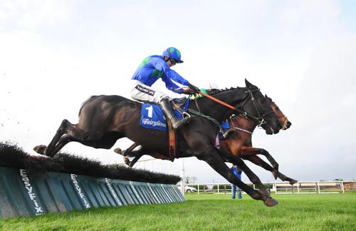 Allblak Des Places (Ruby Walsh) jumps the last with Outspoken (mostly hidden)