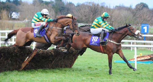 Joshua Lane leads Blazer (white cap) and Mighty Concorde (hidden) over the last