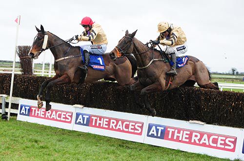 Boston Bob (nearside, winner, Ruby Walsh) jumps the last with On His Own (Patrick Mullins)