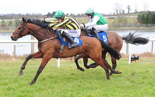 Oiche Mhaith Boy and Brian O'Connell lead Noble Vision and Sean Flanagan away from the last