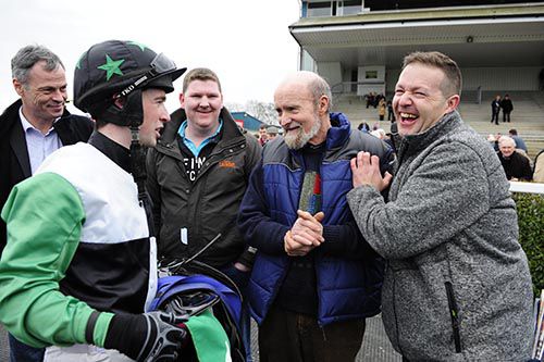 Jonathan Moore debriefs owner Shane Pegley (right) and trainer Tom O'Connor (second from right)