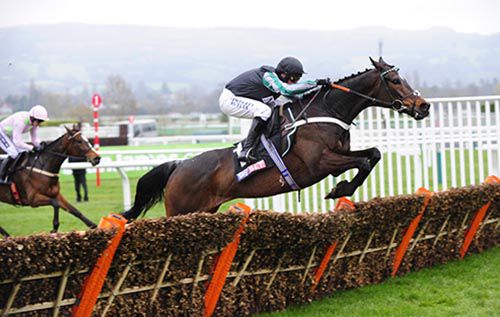 Altior (Nico de Boinville) is clear of Min at the last in the Sky Bet Supreme Novices' Hurdle