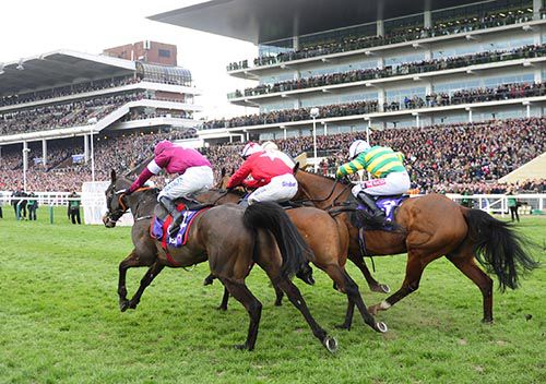 Blaklion (centre, red colours) races on the run-in