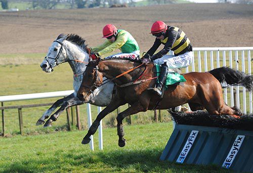 Jimmy Two Times, near side, moves into contention over the last