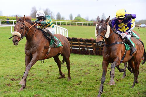 Heathfield (left) and Dramatic Event race away from the last