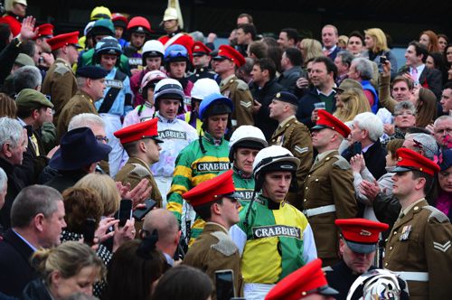 Leighton Aspell leads out the jockeys for the National