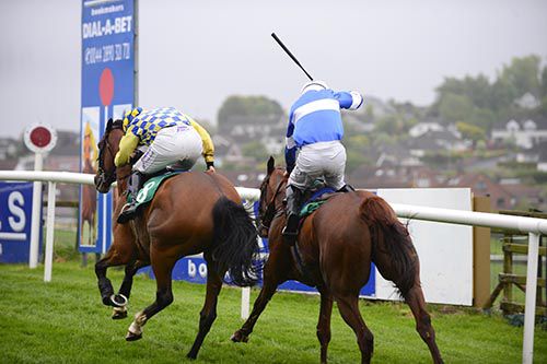 Sean Flanagan (blue and white) gets Drumhart up to pip Personal Shopper (Rachael Blackmore, yellow and blue)