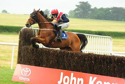 Pops Well and Ambrose McCurtin jumping the last