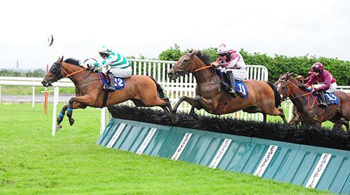 Station Closed (left) is about to be headed by Kentucky Lass at the last