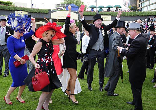 Kinema's connections celebrate after the result of the steward's enquiry is announced