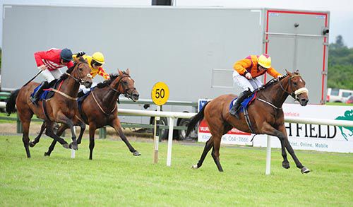Mountain Rock is ridden out by Jamie Codd to beat Storm Racer (red) and Lakemilan