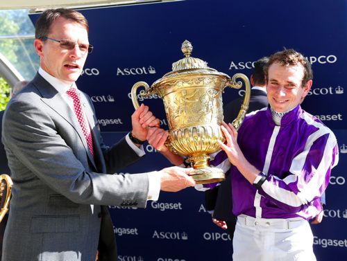 Aidan O'Brien and Ryan Moore hold the King George trophy