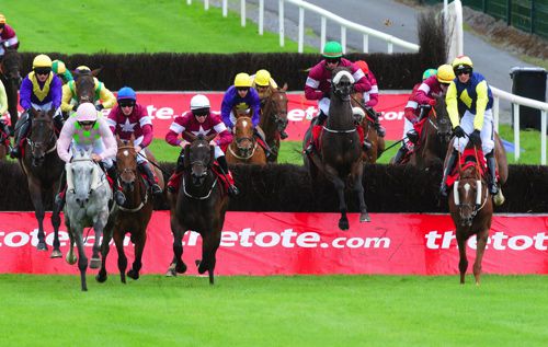 Lord Scoundrel (Green cap) jumping the last fence