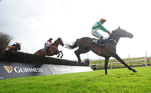 On Fiddlers Green and Davy Russell chase eventual 3rd Knockanarrigan over the last