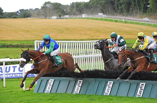 Aurora's Dream and Mark Flanagan clear the last as Mr Smith (green and white) blunder
