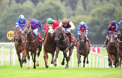 Joyce Compton (green cap) tries make her way through a gap before going on to score under Billy Lee