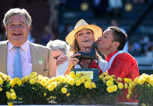Bo Derek get a kiss from Frankie Dettori