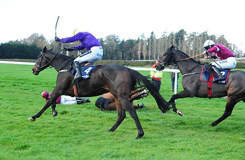 Alelchi Inois (Ruby Walsh, nearside) takes advantage of Outlander's fall, racing on from Clarcam