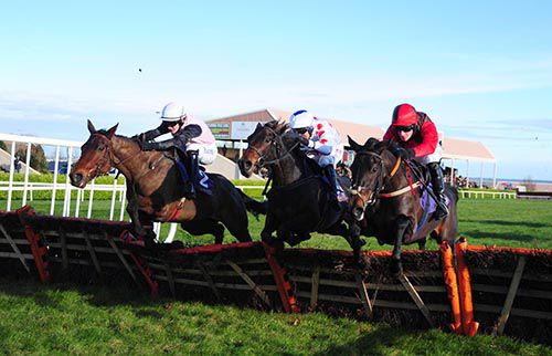 Forge Meadow (centre) jumps the last along with Theatre Dreams (right) and Toe The Line (left)