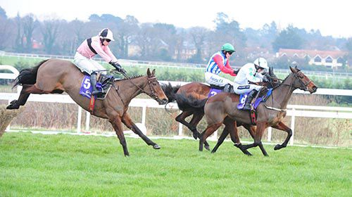 Toe The Line (pink and black) gives chase over the last