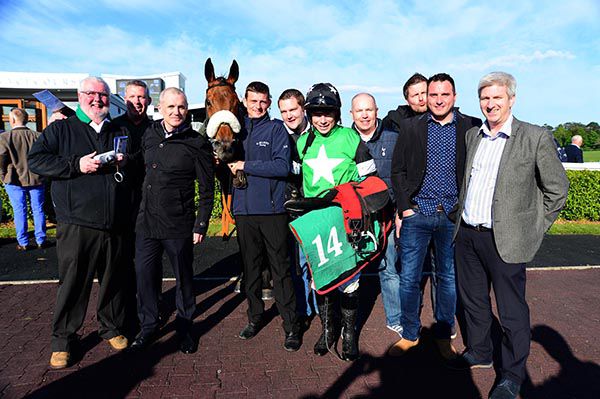 Station Closed and jockey Denis O'Regan are joined by members of the Gordon Elliott Racing Club 