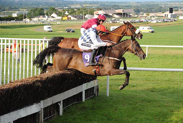 Rathvinden (closest) and Ballela Boy clear a fence
