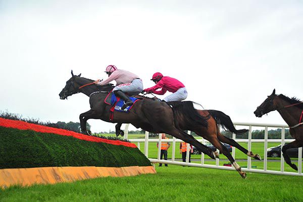 Westland Row (nearest) jumps the last under Davy Russell