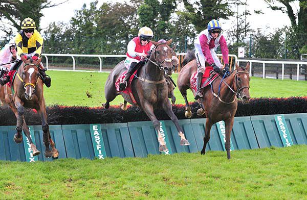 Ballyegan Hero (centre) and Rachael Blackmore clear the last
