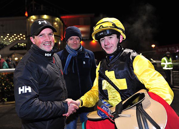 Trainer Keith Clarke congratulates Ben Coen on his first winner