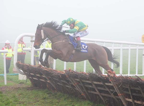 Rock On Barney (Evan Daly) clears the last at a foggy Clonmel