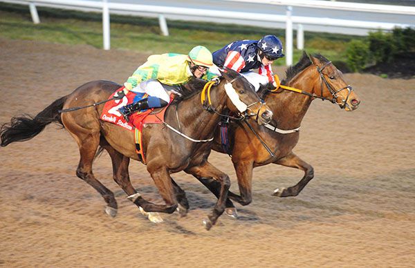 Specific Gravity and Thomas Sherry (nearside) were awarded the race after going down by a head to Trump Card