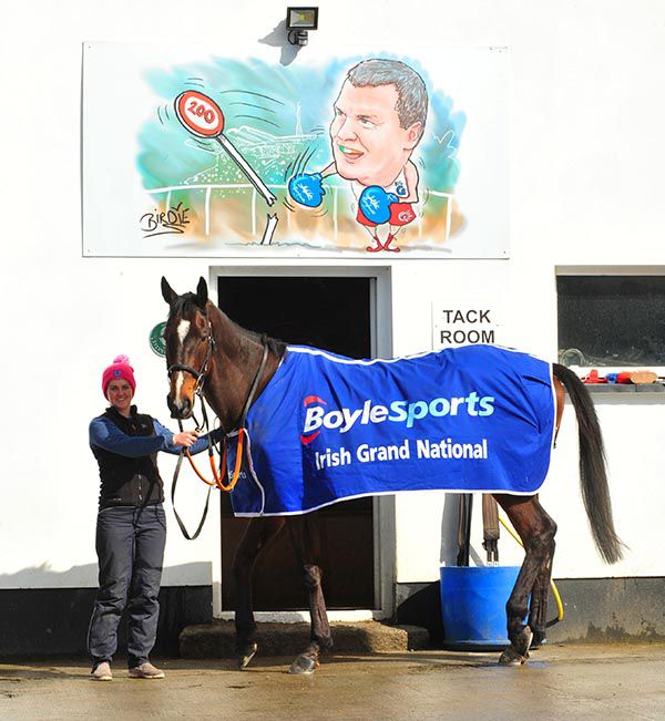 General Principle with groom Seainin Mahon under a Darren Birdie drawing of Gordon Elliott at Cullentra Stables