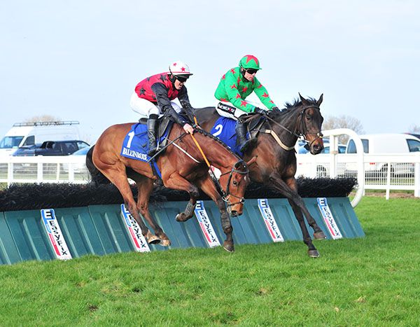 Carrig Cathal, far side, jumps the last before drawing on from Prospectus