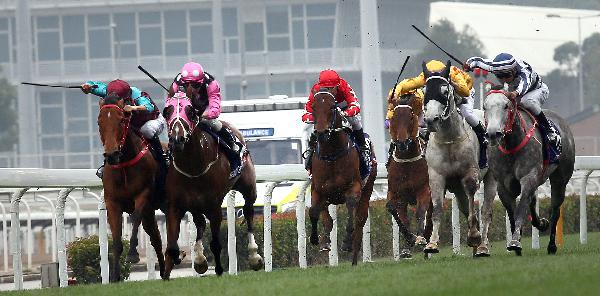 Beauty Generation (pink cap) wins the G1 Queen's Silver Jubilee Cup.