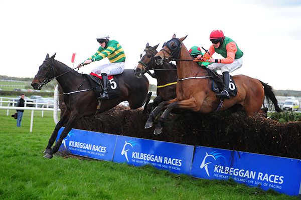 Take The Cash (nearest) jumps the last alongside Don't Le Go (McManus colours) and Glenwood For Ever (centre)