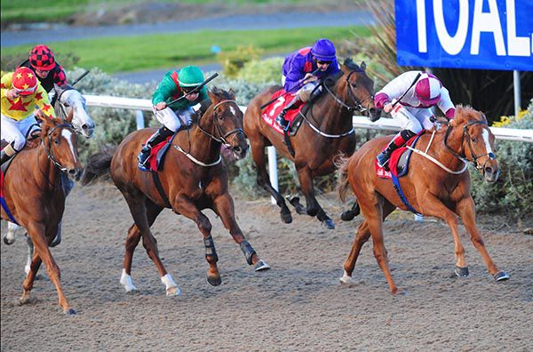 Georgie Hyphen and Colin Keane (right) lead them home in the penultimate at Dundalk