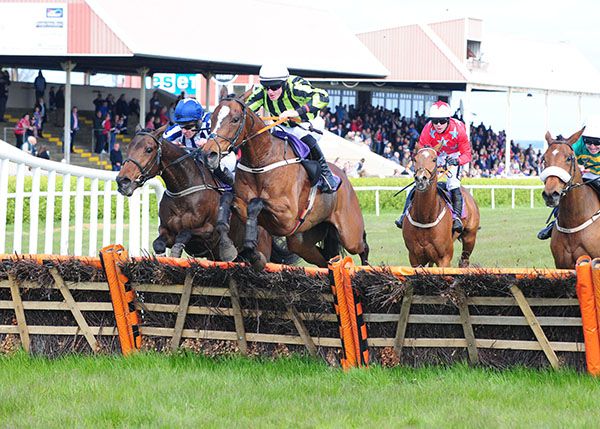 Officers Mess jumps the last under Ricky Doyle, with Lady Mangan (blue cap) on his outer