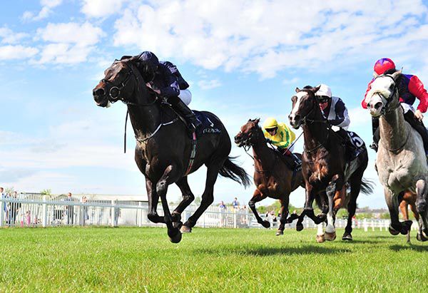 Cliffs Of Moher powers home under Ryan Moore, with the grey Success Days on his inside