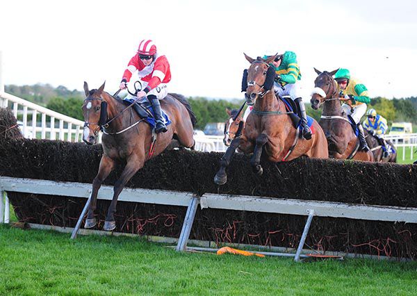 Dinnie's Vinnie, left, jumps the last on his way to victory