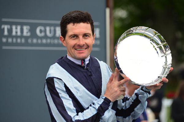 Colm O'Donoghue shows off his Guineas prize at the Curragh