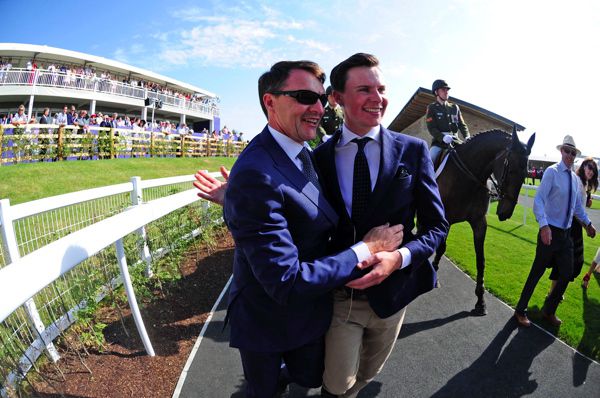 Joseph congratulated by his father Aidan