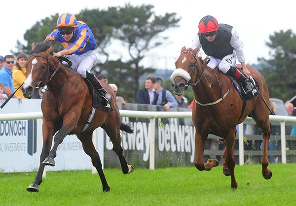 Broome, left, fends off Lightning Amber