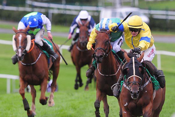 Folly Dat (right) is ridden out by Andrew Ring